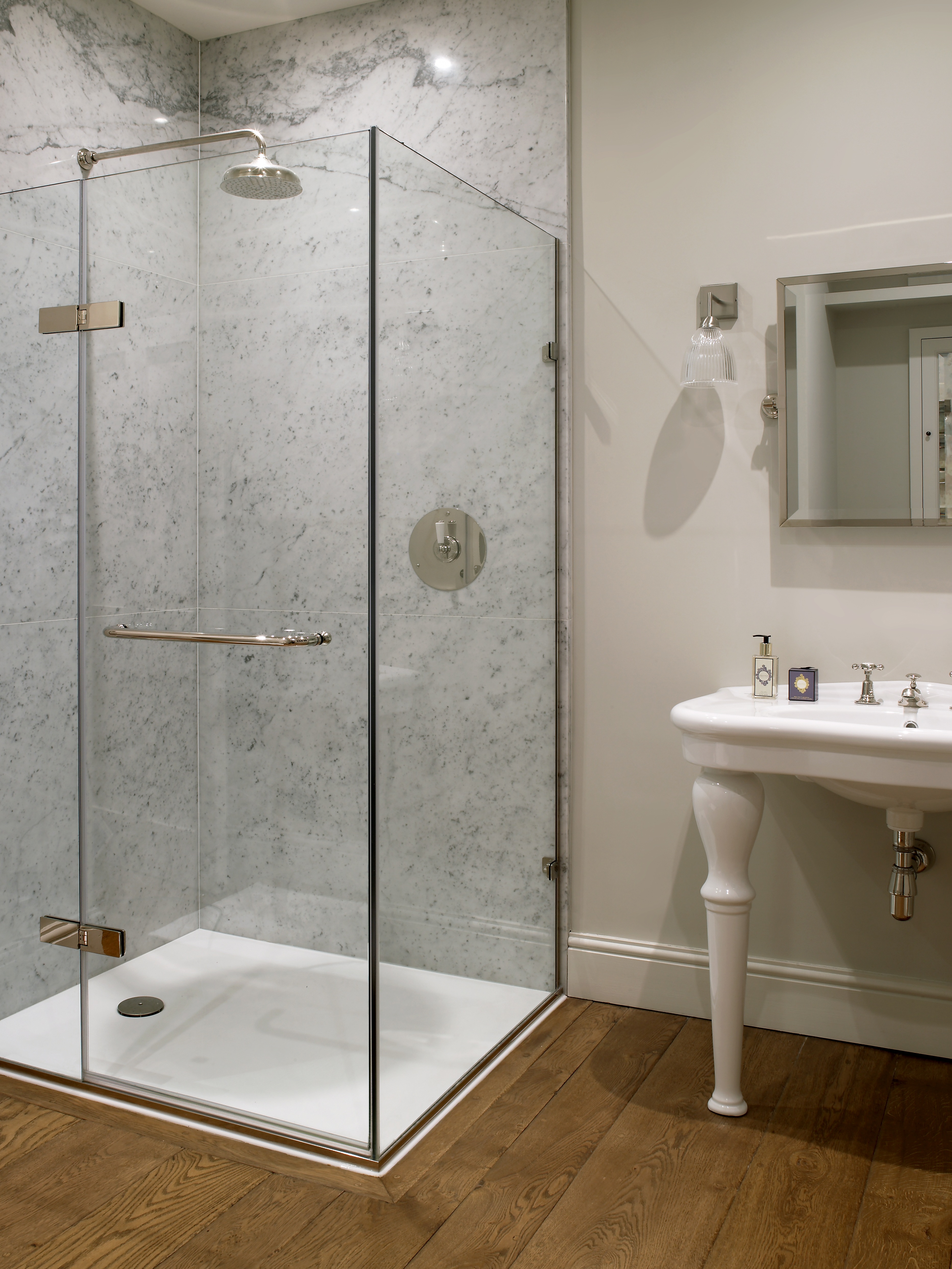 Classic bead & board panelling in cloakroom with glass mosaic tiles using blue grey colour scheme.