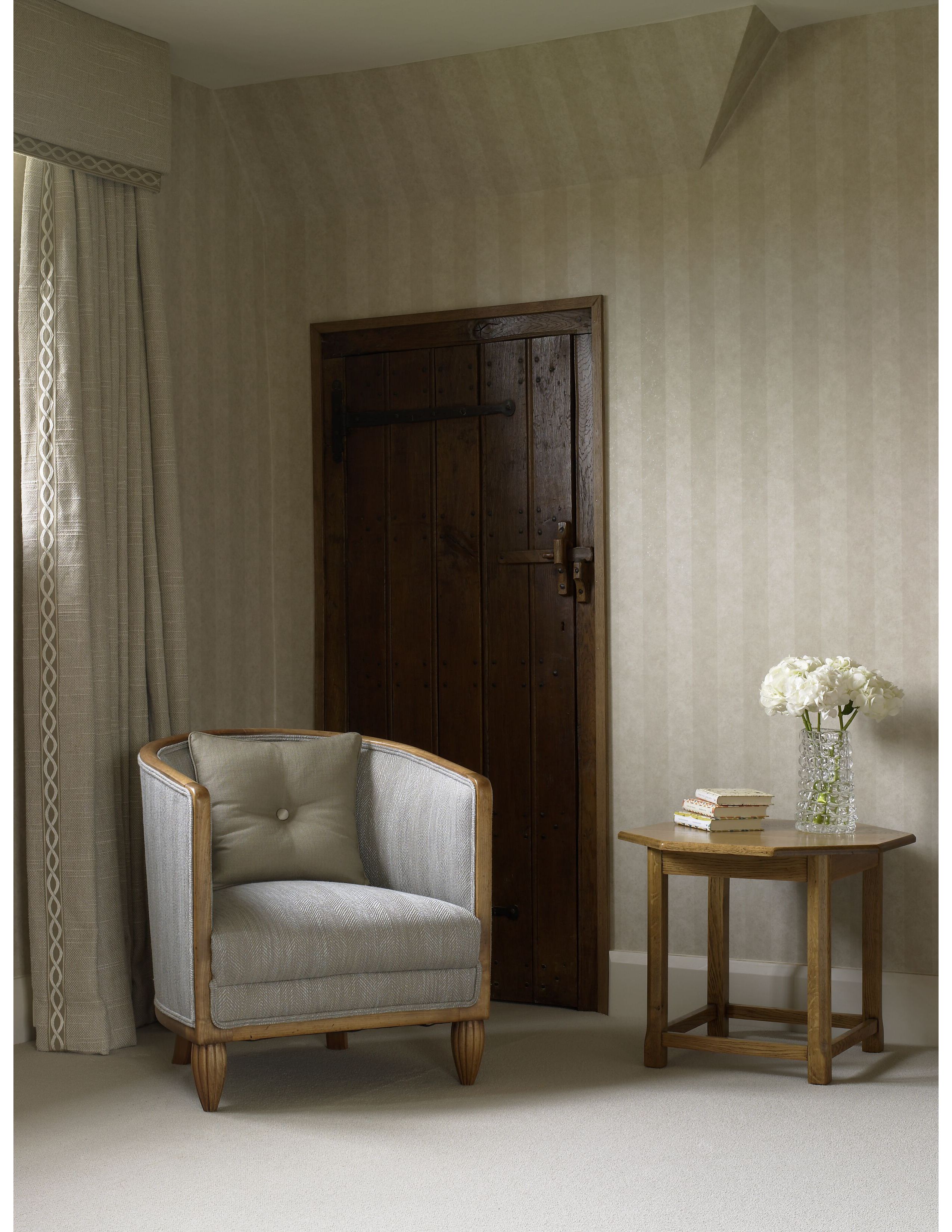 Maron honed marble used with metallic floral wallpaper in cloakroom scheme.